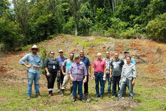 A farmer trainer with a group of farmers in Puerto Rico