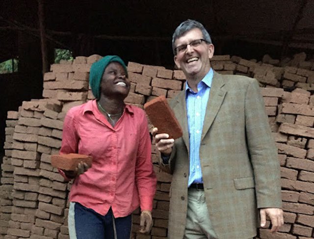 TechnoServe President William Warshauer with Gloriose in northern Rwanda, November 2015.