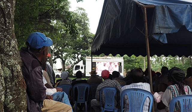 Mobile Training Unit (MTU) taking place in a town square in Kenya