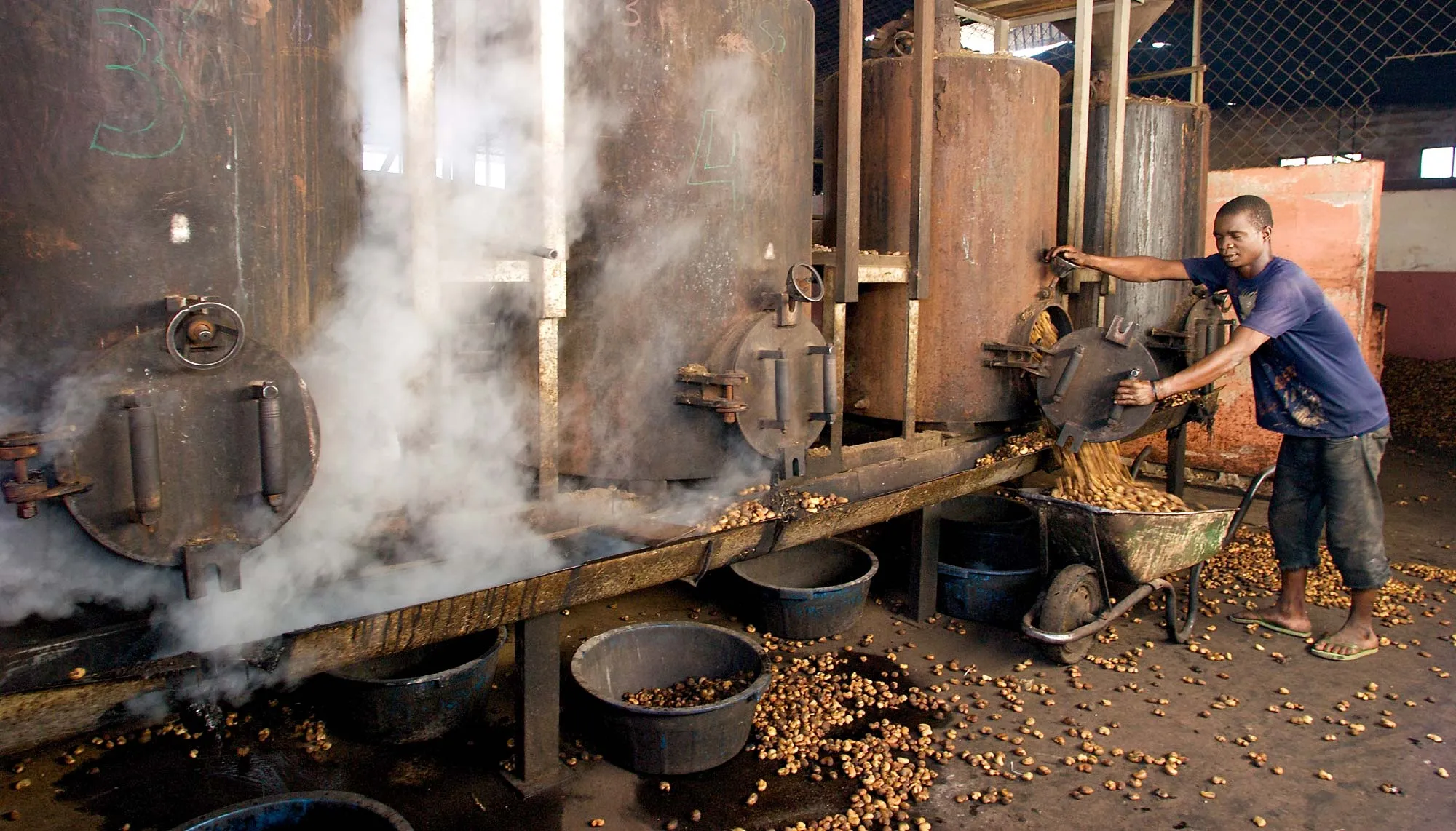 Man processing beans in Mozambique