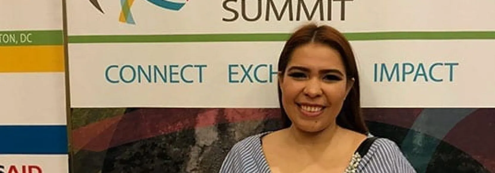 Woman smiling listening to young leaders