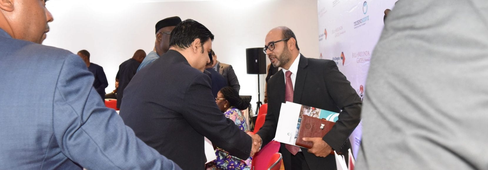 Two business men shaking hands in Nigeria