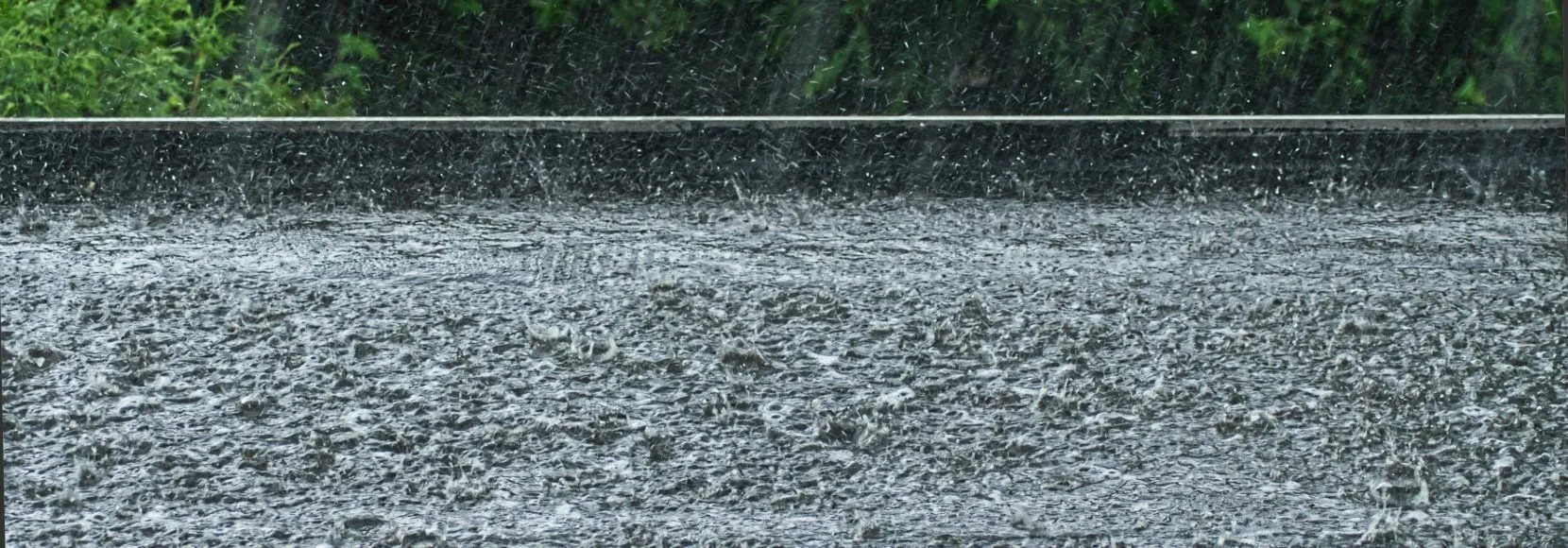 rain on a black flat roof