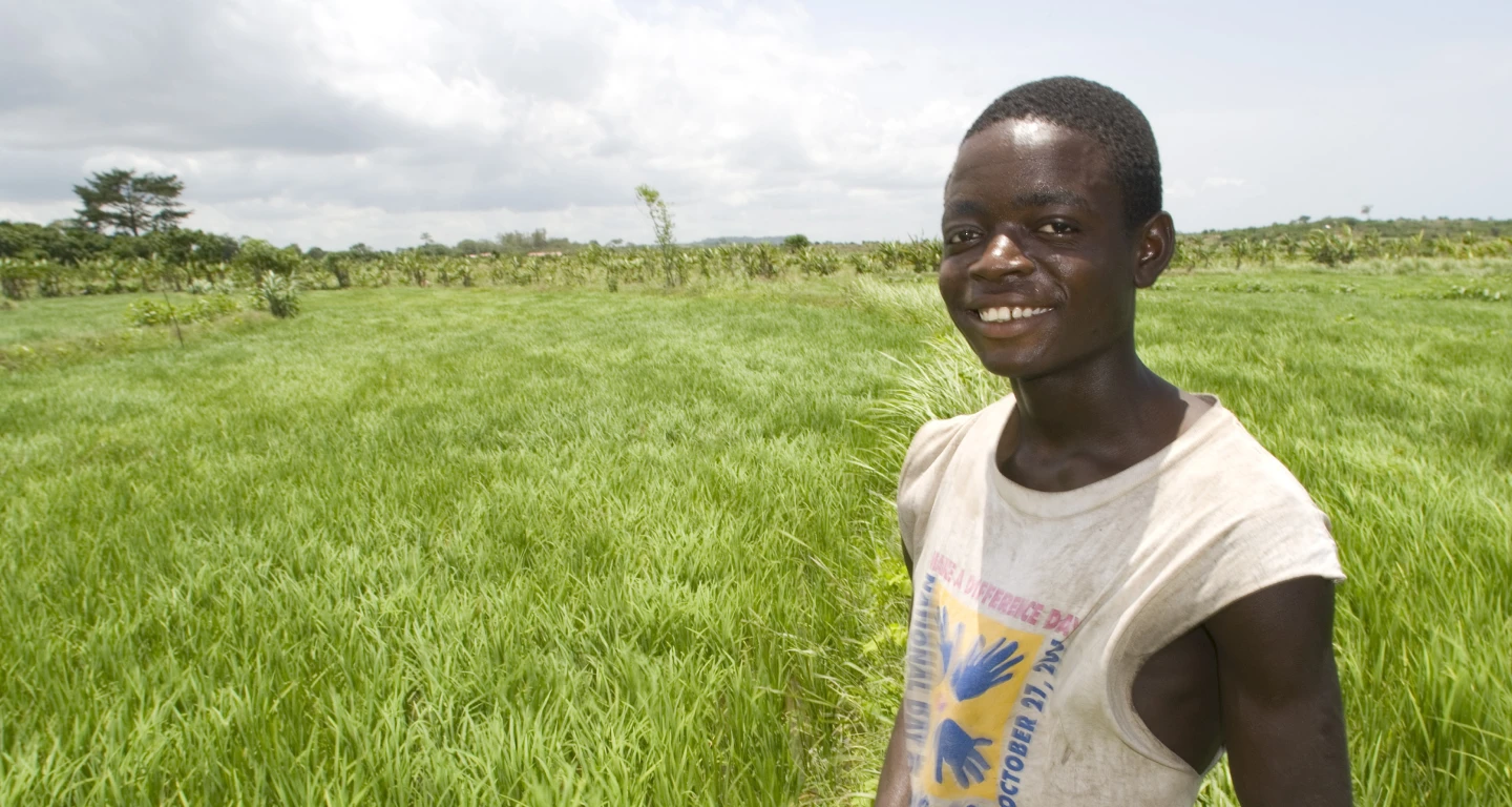 Smiling Young Adult in Field