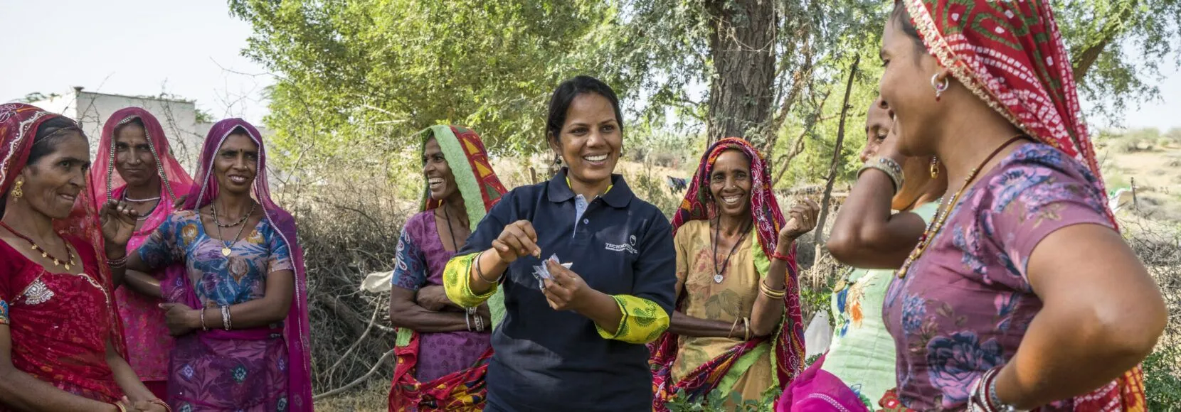 A TechnoServe trainer provides guidance to women farmers in India, enabling them to access better markets and achieve business solutions to poverty.