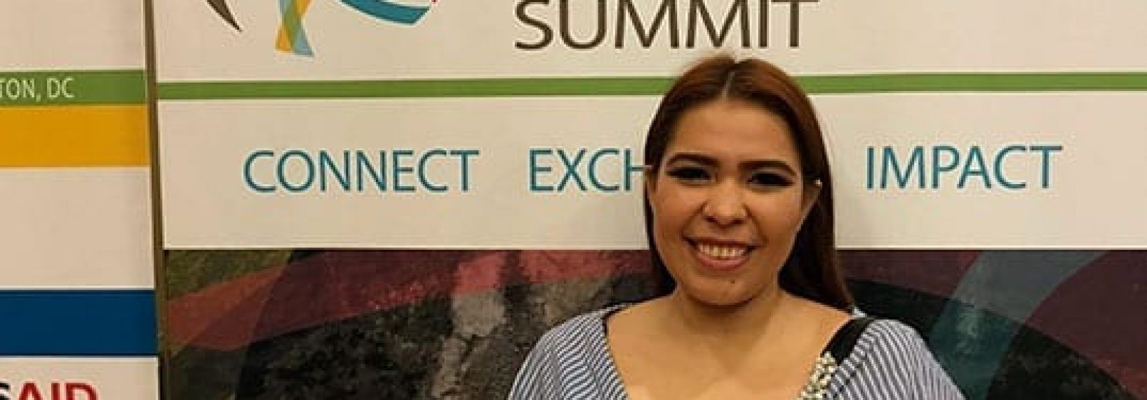 Woman smiling listening to young leaders