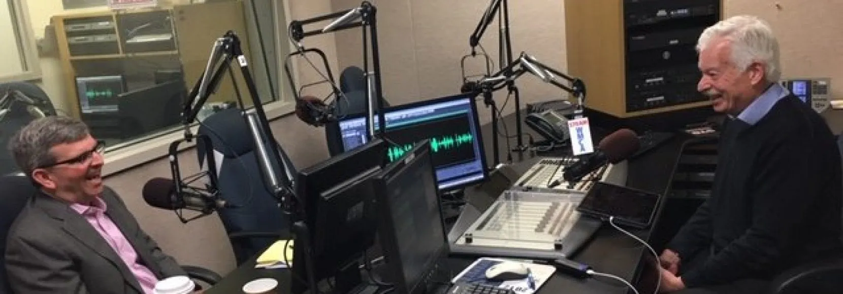 Two men in a radio broadcast room