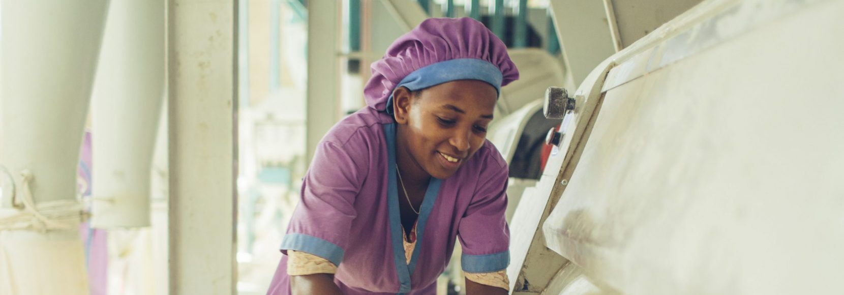 A woman worker at a grain mill in Sannie, Ethiopia