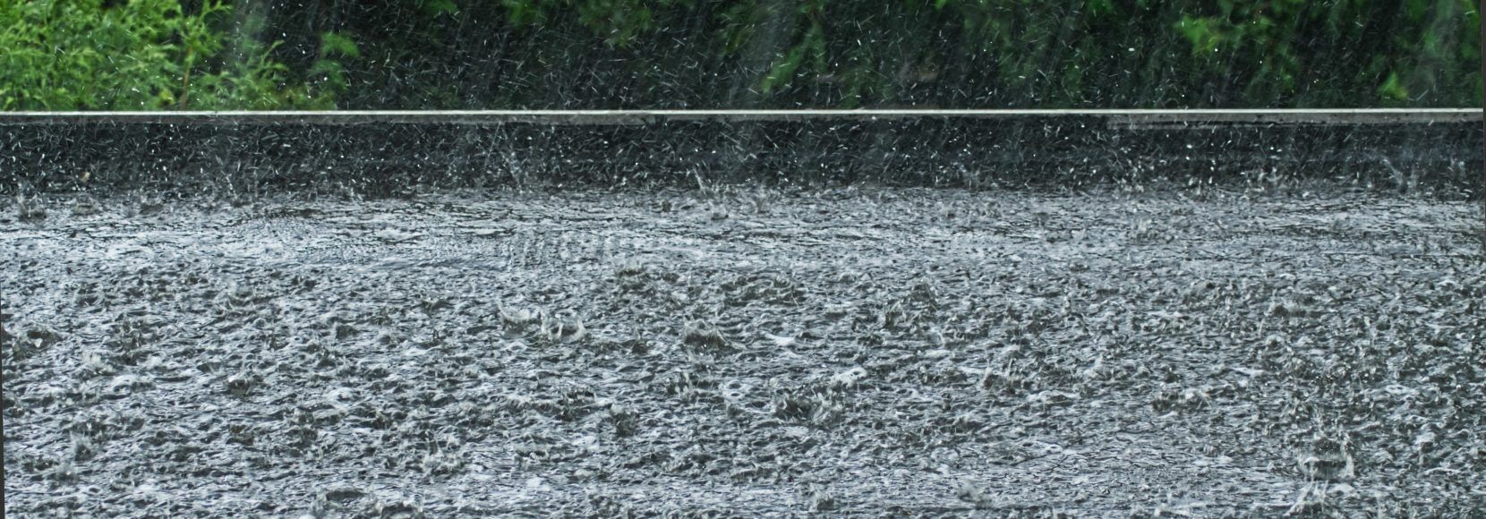 rain on a black flat roof