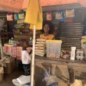 Ermelinda Cumbe an agent at M-Pesa, Africa‘s most successful mobile money service and the region’s largest fintech platform. She also earns income through her own business, a grocery street stall where she sells basic necessities. TechnoServe is working with the Swedish International Development Cooperation Agency (Sida) to help entrepreneurs like Ermelinda find long-term success through a “market systems” approach: the Women in Business (WIN) project. TechnoServe worked with was MZ Nyeleti, a Mozambican start-up organization, which acts as a super-agent for M-Pesa. The start-up provides float to M-Pesa agents in a city located in southern Mozambique called Inhambane. Through MZ Nyeleti, Ermelinda began taking classes on business management and learned how the start-up could attract customers to her own business. She then joined a WhatsApp group with other women entrepreneurs, where they share motivation and entrepreneurial tips on how to manage their businesses.