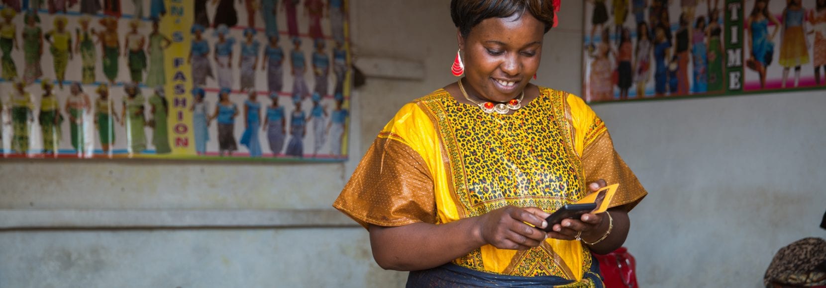 Woman holding smartphone smiling