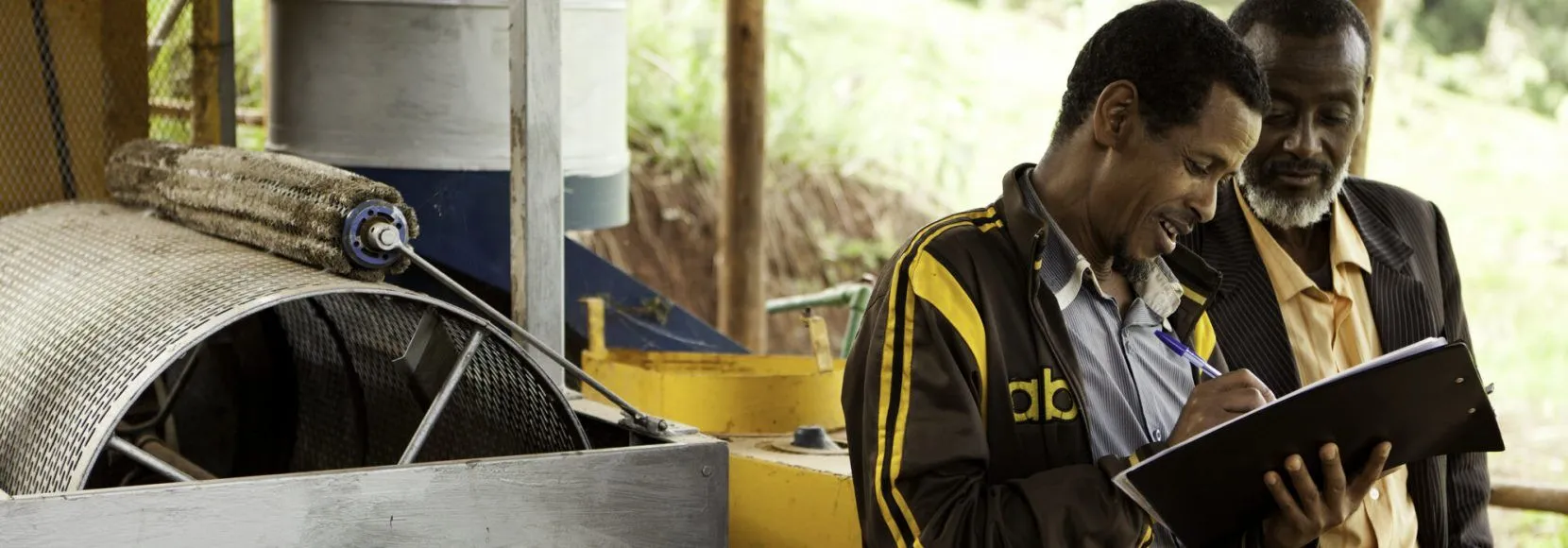 TechnoServe business advisor at cooperative coffee wet mill in Ethiopia