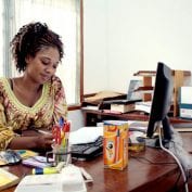 Woman working at a desk in ghana