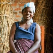 Woman smiling with thickets