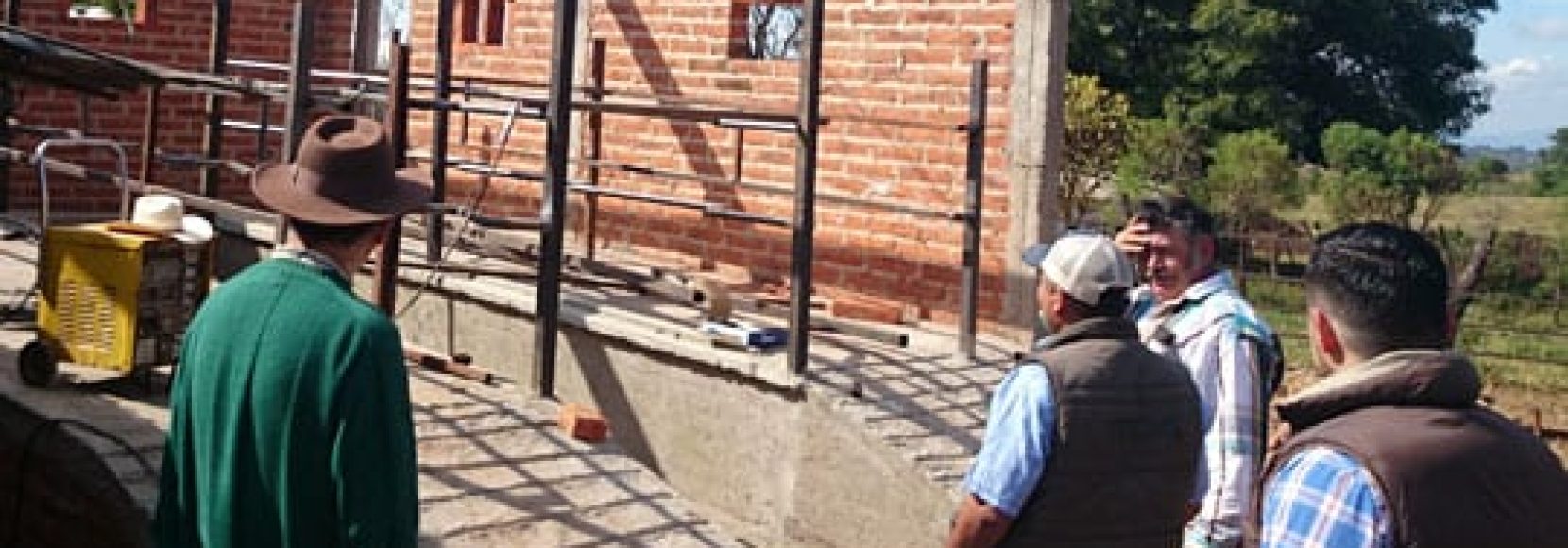 Men working on building a new brick building