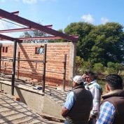 Men working on building a new brick building