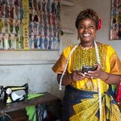 Woman smiling with smartphone