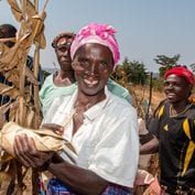 Farmer smiling holding harvest