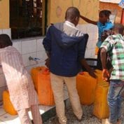 Group of people working to clean water