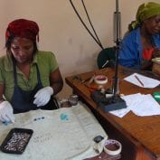 Two women working on jewelry