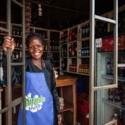 Woman smiling in her store in Uganda