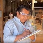 Business man working writing down logs