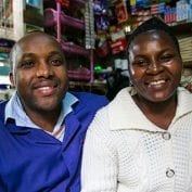 Couple smiling together in their store