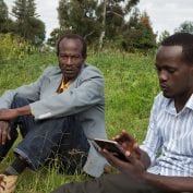 Two people working together with technology