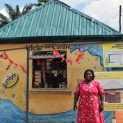 Woman smiling in front of her business