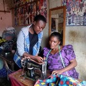 Two women sewing together