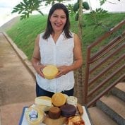 Woman smiling with food on a table