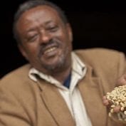 Man tossing coffee beans