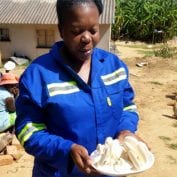 Woman holding plate of food