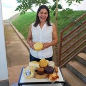 Woman smiling with tray of food