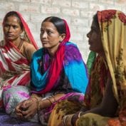 Women vegetable farmers have a discussion during a Producer Group meeting