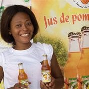 Woman smiling holding class drinks