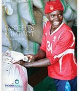 Woman smiling with sacks of food