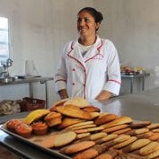 Woman working with cooked bread