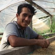 Wilmer in peru drying coffee beans