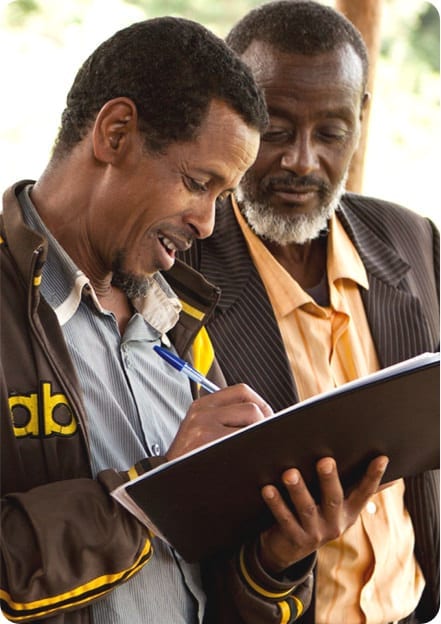 Two men working on financials