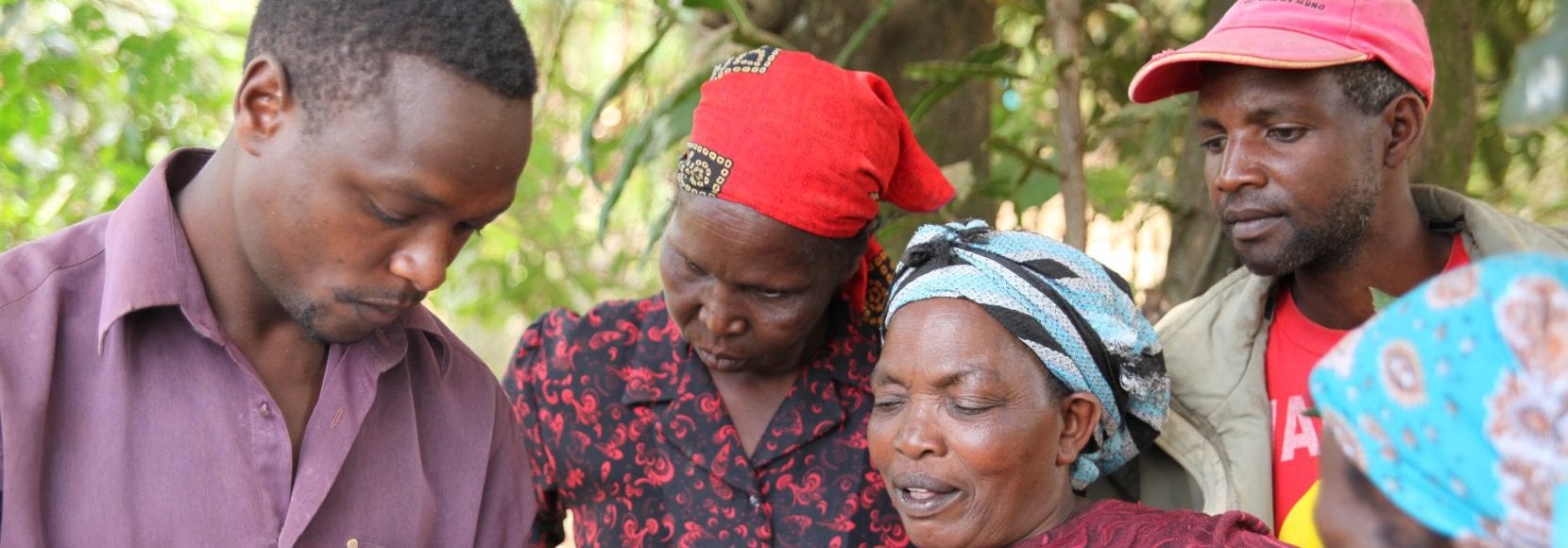 Staff from the Nespresso AAA project in Kenya training a group of coffee farmers.