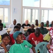 Group of people in classroom smiling