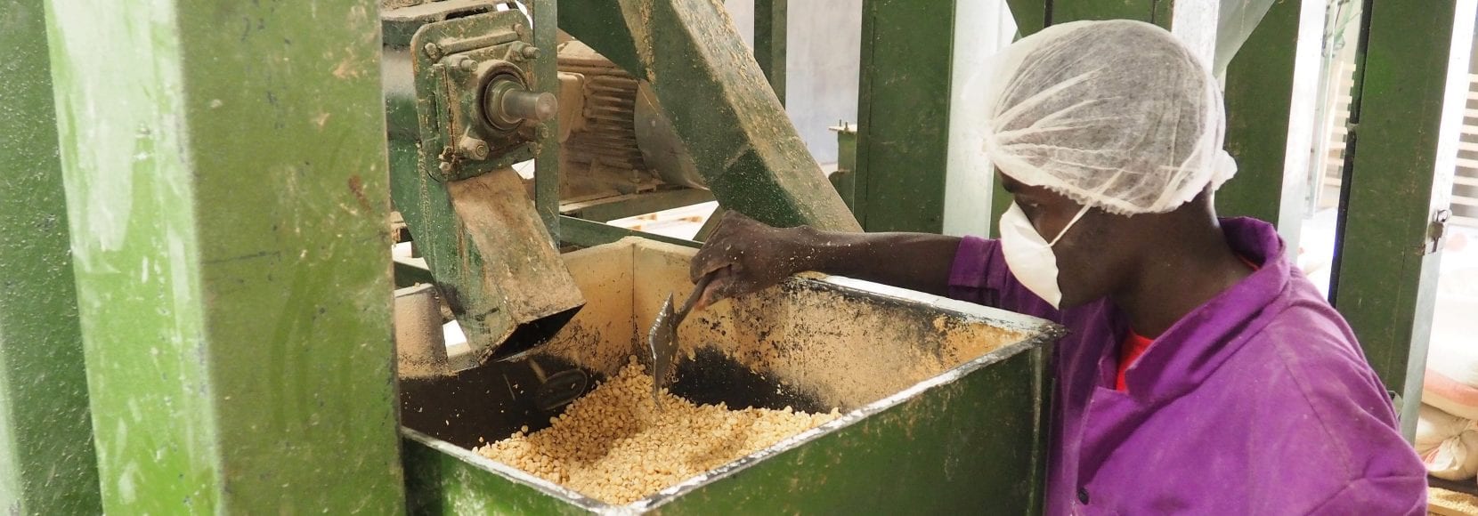 A food fortification professional, this man is working at a food processor in Kenya supported by TechnoServe training program SAFE