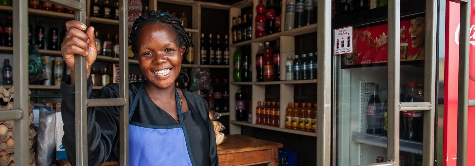 One of the many TechnoServe clients who went on to launch small businesses in developing countries, Maria Kayinza’s micro-retail store in Mukono, Uganda. STRYDE participant.