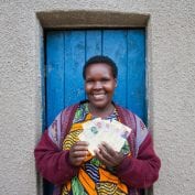 TechnoServe's solutions for poverty include a focus on gender equality. This photo is of a program participant, Jackeline Mukandori with 