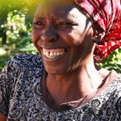 Woman smiling while working in Zimbabwe