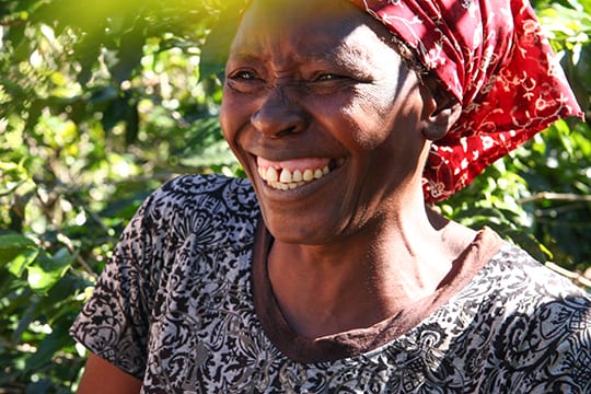 Woman smiling while working in Zimbabwe