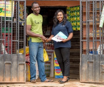 entrepreneur and TechnoServe business adviser from Mom and Pop Shops project in Nigeria