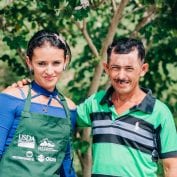 Couple working together on farm