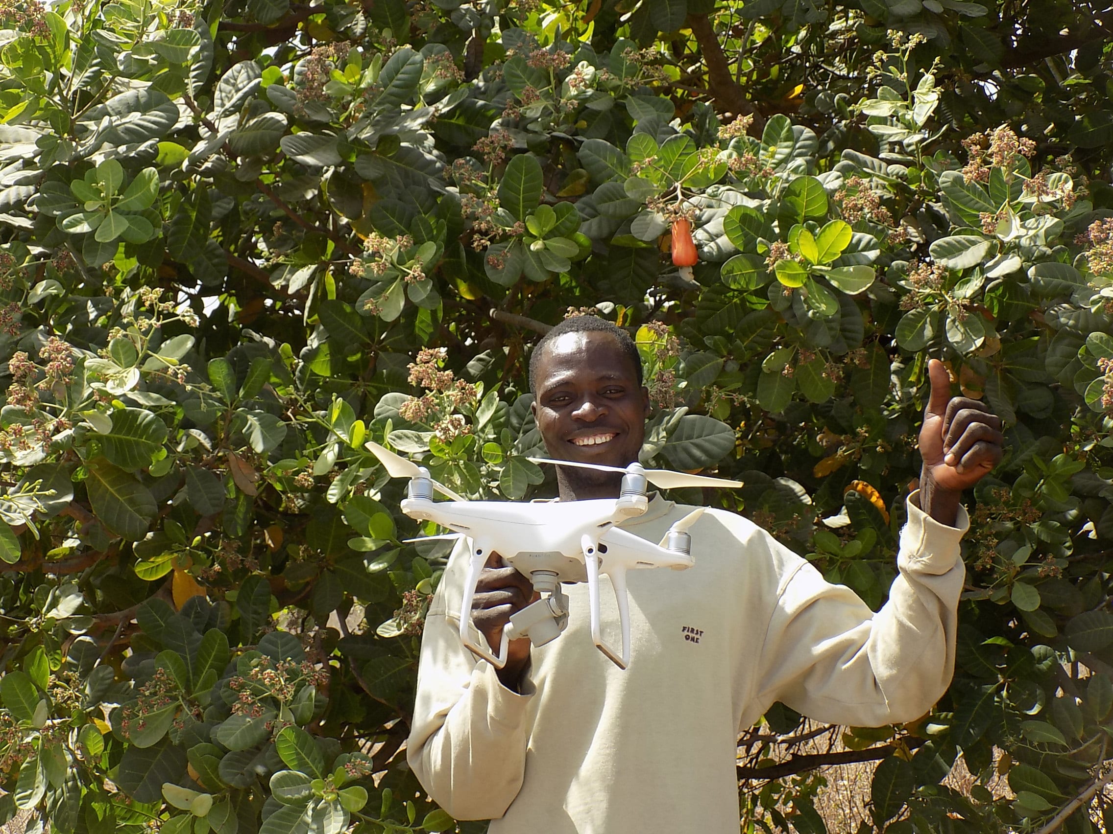Man smiling holding drone